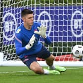 Nick Pope of England dives for the ball during a training session at Tottenham Hotspur Training Centre on September 04, 2021 in Enfield, England. 