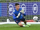Nick Pope of England dives for the ball during a training session at Tottenham Hotspur Training Centre on September 04, 2021 in Enfield, England. 