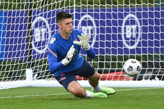 Nick Pope of England dives for the ball during a training session at Tottenham Hotspur Training Centre on September 04, 2021 in Enfield, England. 