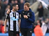 Newcastle United head coach Eddie Howe speaks with Miguel Almiron. (Photo by Stu Forster/Getty Images)