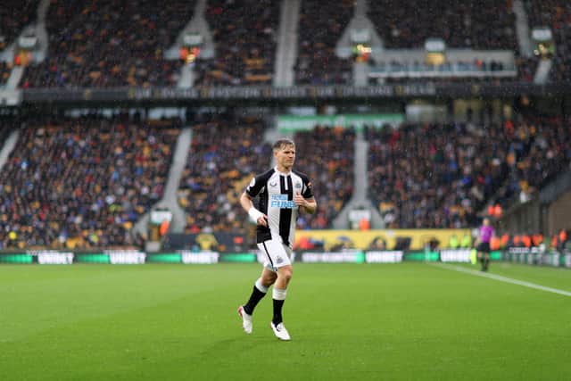 Matt Ritchie of Newcastle United prepares to take a corner kick during the Premier League match between Wolverhampton Wanderers and Newcastle United at Molineux on October 02, 2021 in Wolverhampton, England. 
