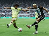 Joelinton of Newcastle United shoots under pressure from Mohamed Elneny of Arsenal during the Premier League match between Newcastle United and Arsenal at St. James Park on May 16, 2022 in Newcastle upon Tyne, England.