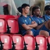Hwang Hee-Chan, Adama Traore and Nelson Semedo of Wolverhampton Wanderers look on during a pre-season friendly match between Deportivo Alaves and Wolverhampton Wanderers at Estadio Camilo Cano on July 20, 2022 in Benidorm, Spain. 
