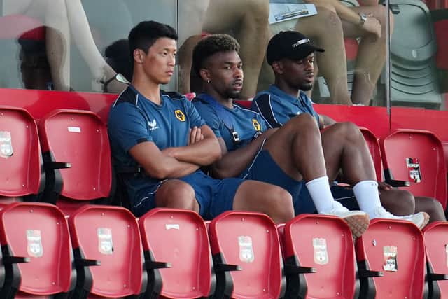 Hwang Hee-Chan, Adama Traore and Nelson Semedo of Wolverhampton Wanderers look on during a pre-season friendly match between Deportivo Alaves and Wolverhampton Wanderers at Estadio Camilo Cano on July 20, 2022 in Benidorm, Spain.