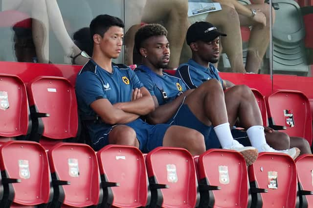 Hwang Hee-Chan, Adama Traore and Nelson Semedo of Wolverhampton Wanderers look on during a pre-season friendly match between Deportivo Alaves and Wolverhampton Wanderers at Estadio Camilo Cano on July 20, 2022 in Benidorm, Spain. 