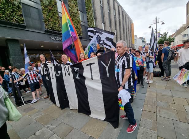 <p>NUFC fans march at the parade</p>