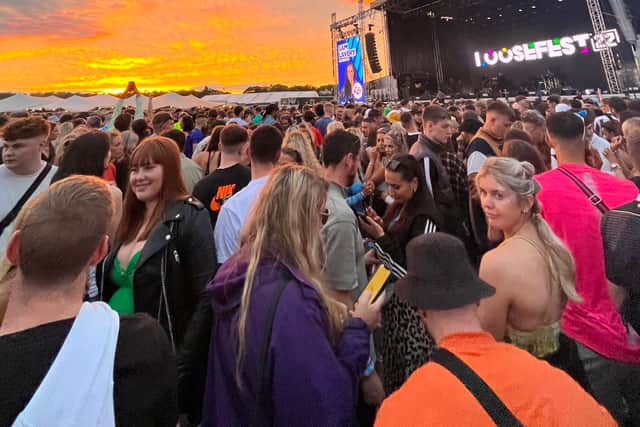 The sun sets as the crowd waits for the Black Eyed Peas