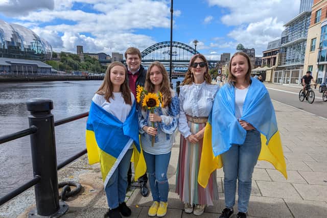 Choir of young Ukrainian residents performed on Newcastle quayside to support the bid for Eurovision 2023. (L to R) Zhanna age 17, Cabinet member for a Resilient City Cllr Alex Hay, Lyza age 12, Cabinet member for a Vibrant City, Cllr Lesley Storey and Vlada age 13.