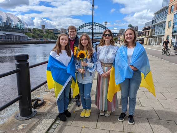 Choir of young Ukrainian residents performed on Newcastle quayside to support the bid for Eurovision 2023. (L to R) Zhanna age 17, Cabinet member for a Resilient City Cllr Alex Hay, Lyza age 12, Cabinet member for a Vibrant City, Cllr Lesley Storey and Vlada age 13.