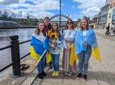 Choir of young Ukrainian residents performed on Newcastle quayside to support the bid for Eurovision 2023. (L to R) Zhanna age 17, Cabinet member for a Resilient City Cllr Alex Hay, Lyza age 12, Cabinet member for a Vibrant City, Cllr Lesley Storey and Vlada age 13.