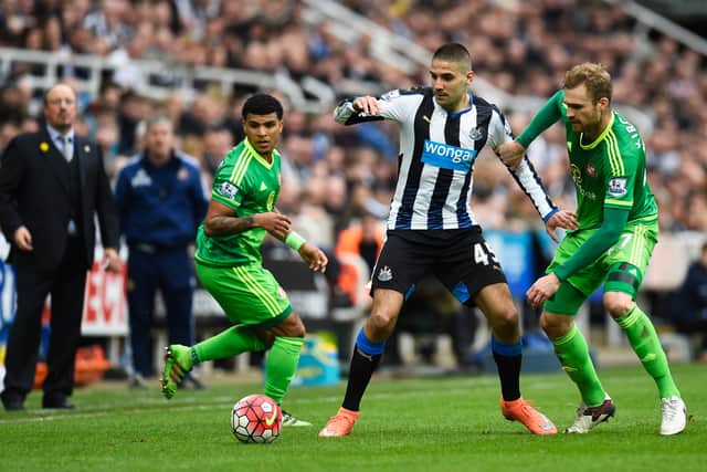 Newcastle United striker Aleksandar Mitrovic takes on DeAndre Yedlin (L) and Jan Kirchhoff of Sunderland (R) during the last competitive meeting of the Tyne and Wear rivals in March 2016  (Photo by Stu Forster/Getty Images)