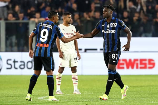 Duvan Zapata of Atalanta is congratulated by teammate Luis Muriel after scoring their side’s first goal against AC Milan in October 2021 (Photo by Marco Luzzani/Getty Images)