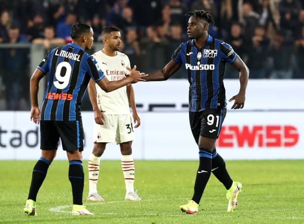 <p>Duvan Zapata of Atalanta is congratulated by teammate Luis Muriel after scoring their side’s first goal against AC Milan in October 2021 (Photo by Marco Luzzani/Getty Images)</p>