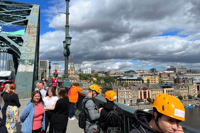 People queue up to take on the zip wire