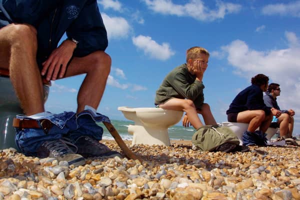 Members of Surfers Against Sewage hold a “toilet protest” August 8, 2001