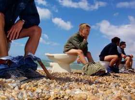 Members of Surfers Against Sewage hold a “toilet protest” August 8, 2001