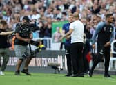 Eddie Howe, Manager of Newcastle United and Pep Guardiola, Manager of Manchester City interact after the final whistle of the Premier League match between Newcastle United and Manchester City at St. James Park on August 21, 2022 in Newcastle upon Tyne, England. 