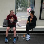 Runners wait for the bus (Image: Getty Images)