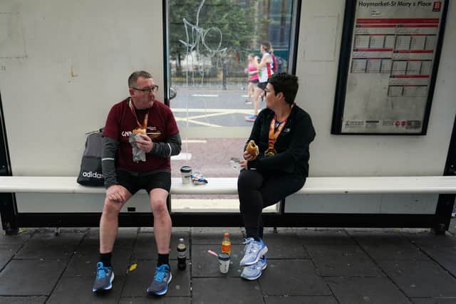Runners wait for the bus (Image: Getty Images)