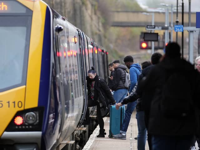 Passengers board train.