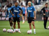 Newcastle United trio Allan Saint-Maximin, Callum Wilson and Bruno Guimaraes. (Photo by OLI SCARFF/AFP via Getty Images)