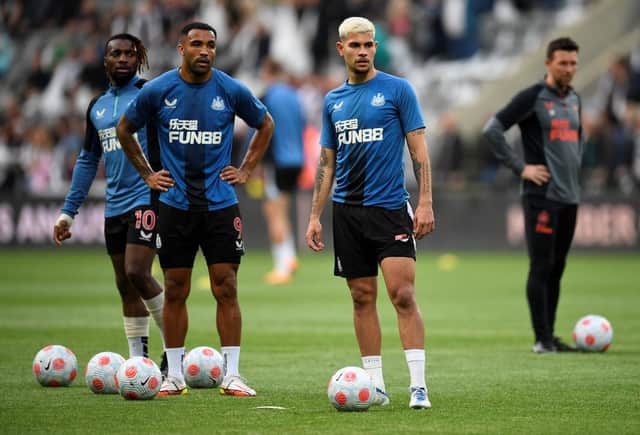 Newcastle United trio Allan Saint-Maximin, Callum Wilson and Bruno Guimaraes. (Photo by OLI SCARFF/AFP via Getty Images)