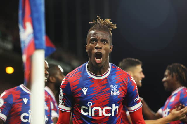 Wilfried Zaha of Crystal Palace celebrates after scoring their team’s first goal during the Premier League . (Photo by Eddie Keogh/Getty Images)