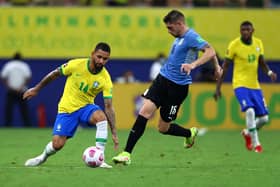 Douglas Luiz of Brazil fights for the ball with Federico Valverde of Uruguay during the South American Qualifiers for Qatar 2022  (Photo by Buda Mendes/Getty Images)