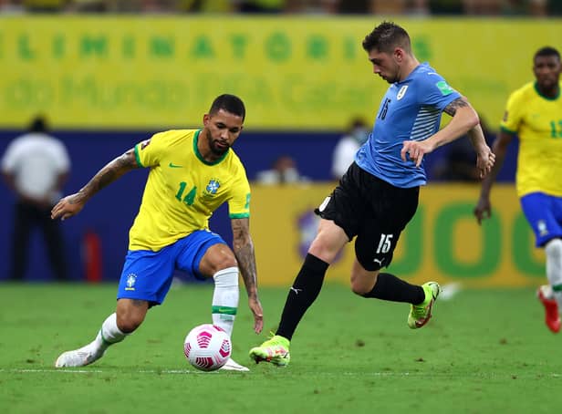 <p>Douglas Luiz of Brazil fights for the ball with Federico Valverde of Uruguay during the South American Qualifiers for Qatar 2022  (Photo by Buda Mendes/Getty Images)</p>