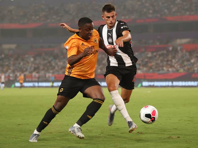 Kelland Watts of Newcastle United in action with Niall Ennis of Wolverhampton Wanderers during the Premier League Asia Trophy 2019 match  (Photo by Lintao Zhang/Getty Images for Premier League)