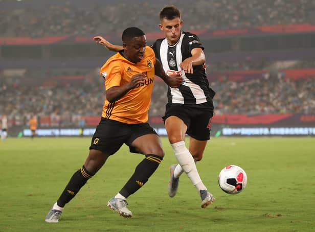 <p>Kelland Watts of Newcastle United in action with Niall Ennis of Wolverhampton Wanderers during the Premier League Asia Trophy 2019 match  (Photo by Lintao Zhang/Getty Images for Premier League)</p>