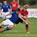George Walters of Manchester United and Cole McKinnon of Rangers compete for the ball during the Super Cup NI football tournament junior section game between Manchester United and Rangers on July 24, 2018 in Ballymena, Northern Ireland. 