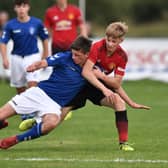 George Walters of Manchester United and Cole McKinnon of Rangers compete for the ball during the Super Cup NI football tournament junior section game between Manchester United and Rangers on July 24, 2018 in Ballymena, Northern Ireland. 