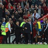 The Liverpool bench celebrate after the winning goal during the Premier League match against Newcastle United (Photo by John Powell/Liverpool FC via Getty Images)