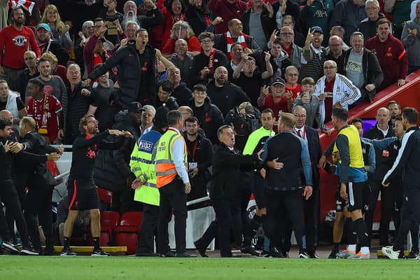 The Liverpool bench celebrate after the winning goal during the Premier League match against Newcastle United (Photo by John Powell/Liverpool FC via Getty Images)