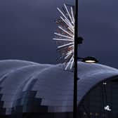 Christmas decorations hang from lamposts on Newcastle quayside