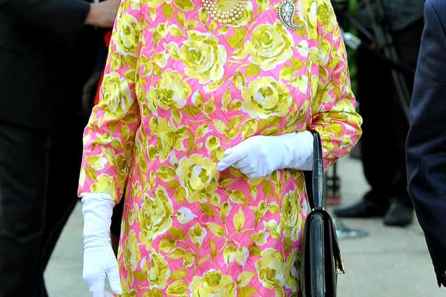 WINNIPEG, CANADA - JULY 3:  Queen Elizabeth II walks out of Government House to unveil a statue of herself on July 3, 2010 in Winnipeg, Canada. The Queen and Duke of Edinburgh are on an eight day tour of Canada, starting in Halifax and finishing in Toronto, to celebrate the centenary of the Canadian Navy and to mark Canada Day on July 1st. On July 6th the royal couple will make their way to New York where the Queen will address the UN and visit Ground Zero. (Photo by John Stillwell - WPA Pool/Getty Images)