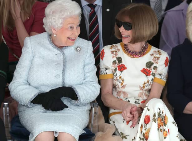 <p>LONDON, ENGLAND - FEBRUARY 20:  Queen Elizabeth II sits next to Anna Wintour as they view Richard Quinn’s runway show before presenting him with the inaugural Queen Elizabeth II Award for British Design as she visits London Fashion Week’s BFC Show Space on February 20, 2018 in London, United Kingdom. (Photo by Yui Mok - Pool/Getty Images)</p>