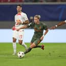 Mykhaylo Mudryk of Shakhtar Donetsk is challenged by Mohamed Simakan of RB Leipzig during the UEFA Champions League group F match between RB Leipzig and Shakhtar Donetsk at Red Bull Arena on September 06, 2022 in Leipzig, Germany. 