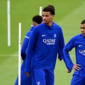 Paris Saint-Germain’s Hugo Ekitike and  Kylian Mbappe take part in a training session at the club’s training ground in Saint-Germain-en-Laye (Photo by FRANCK FIFE/AFP via Getty Images)