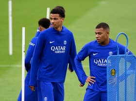 Paris Saint-Germain’s Hugo Ekitike and  Kylian Mbappe take part in a training session at the club’s training ground in Saint-Germain-en-Laye (Photo by FRANCK FIFE/AFP via Getty Images)