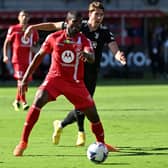 Monza’s Brazilian defender Marlon defends against Juventus’ Serbian forward Dusan Vlahovic (Photo by MIGUEL MEDINA/AFP via Getty Images)