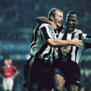  Newcastle strikers Alan Shearer and Les Ferdinand celebrate a goal the 5-0 win against Manchester United in October 1996 (Photo by Ben Radford/Getty Images)