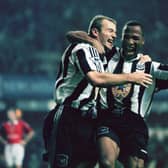  Newcastle strikers Alan Shearer and Les Ferdinand celebrate a goal the 5-0 win against Manchester United in October 1996 (Photo by Ben Radford/Getty Images)