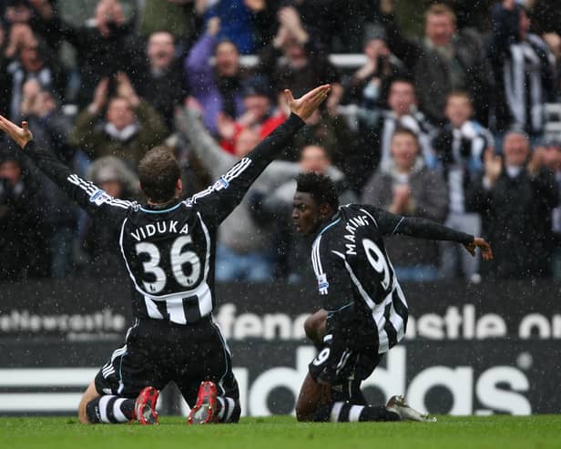 Mark Viduka of Newcastle celebrates scoring the opening goal with Obefemi Martins  during the Barclays Premier League game against Fulham  (Photo by Tom Shaw/Getty Images)