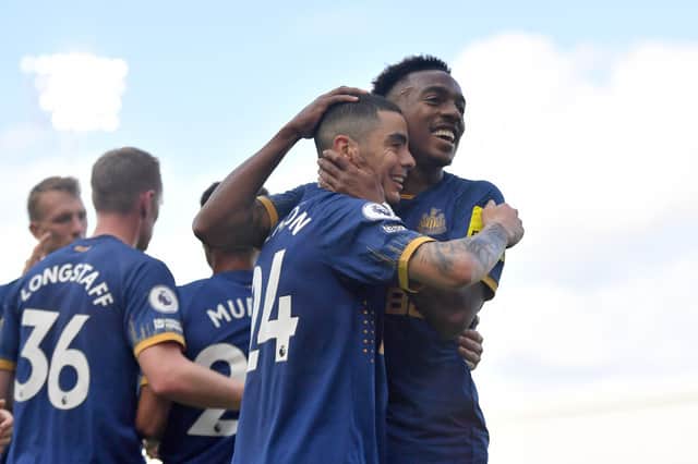 Miguel Almiron of Newcastle United celebrates after scoring their sides fourth goal during the Premier League match between Fulham FC and Newcastle United at Craven Cottage on October 01, 2022 in London, England.