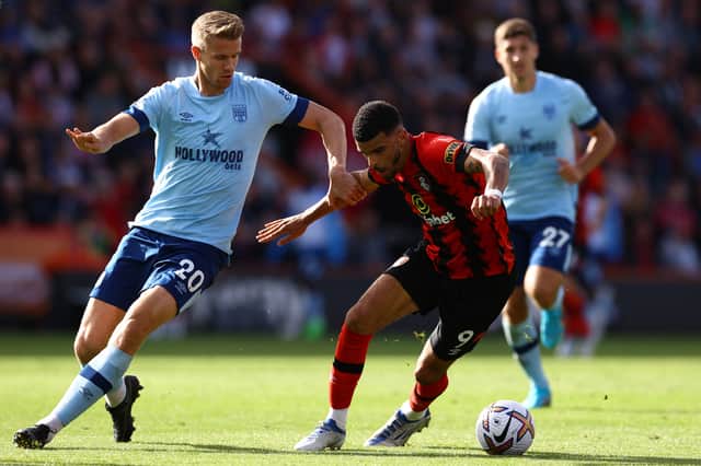 Dominic Solanke of AFC Bournemouth challenged by Kristoffer Ajer of Brentford during the Premier League match between AFC Bournemouth and Brentford FC