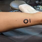 Two employees decided to get their company’s logo tattooed