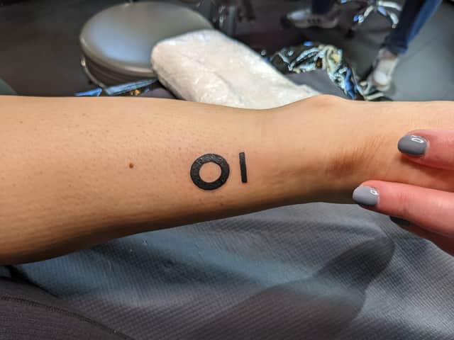 Two employees decided to get their company’s logo tattooed