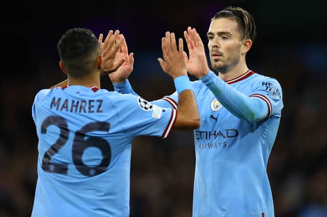 Riyad Mahrez (L) and Jack Grealish celebrate City’s fourth goal against Copenhagen in October 2022